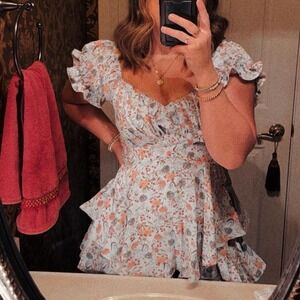 Angel Biba blue floral romper with ruffles and puffy sleeves Size M